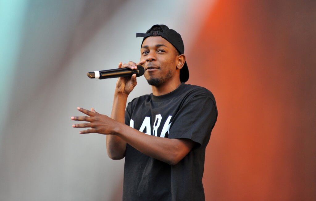 CHELMSFORD, UNITED KINGDOM - AUGUST 18: Kendrick Lamar performs on stage during the final day of the V Festival 2013 at Hylands Park on August 18, 2013 in Chelmsford, England. (Photo by C Brandon/Redferns via Getty Images)