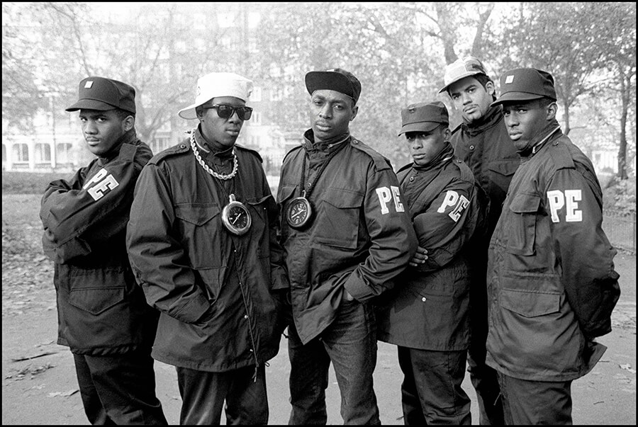 Public Enemy pose for group portraits in Hyde Park, London, 2nd November 1987. Flavor Flav and Chuck D are second and third from left. (Photo by David Corio/Redferns)