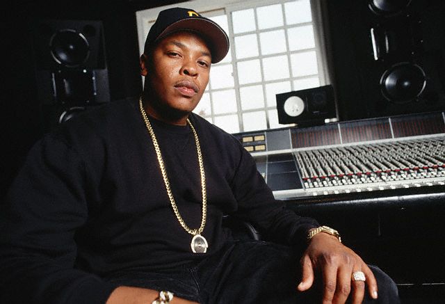 1994, Los Angeles, California, USA --- Rap artist Dr. Dre sits in front of recording equipment at his home in Los Angeles. --- Image by © Neal Preston/CORBIS