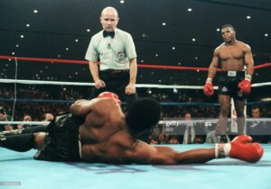 “Iron” Mike Tyson beat Trevor Berbick to become youngest heavyweight in boxing history.